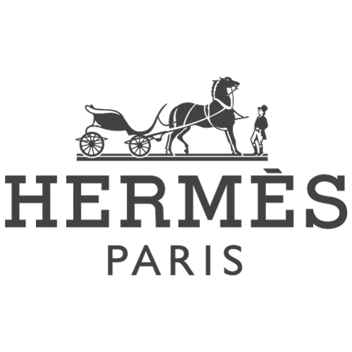 Hermès Paris logo featuring a horse-drawn carriage illustration above elegant serif text, representing timeless French luxury serviced by Sudsies Dry Cleaners.