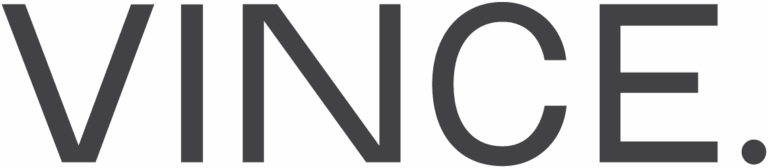 Vince logo in clean, minimalist sans-serif font with a period, reflecting contemporary fashion serviced by Sudsies Dry Cleaners.