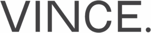 Vince logo in clean, minimalist sans-serif font with a period, reflecting contemporary fashion serviced by Sudsies Dry Cleaners.